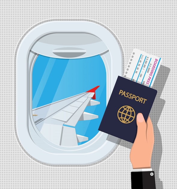 飛行機の中から窓 パスポートとチケットを手に 航空機の舷窓シャッターと翼 空の旅や休暇の概念 フラットスタイルのイラスト プレミアムベクター