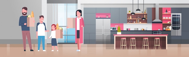 Young family holding bags with grocery products in kitchen room Premium Vector