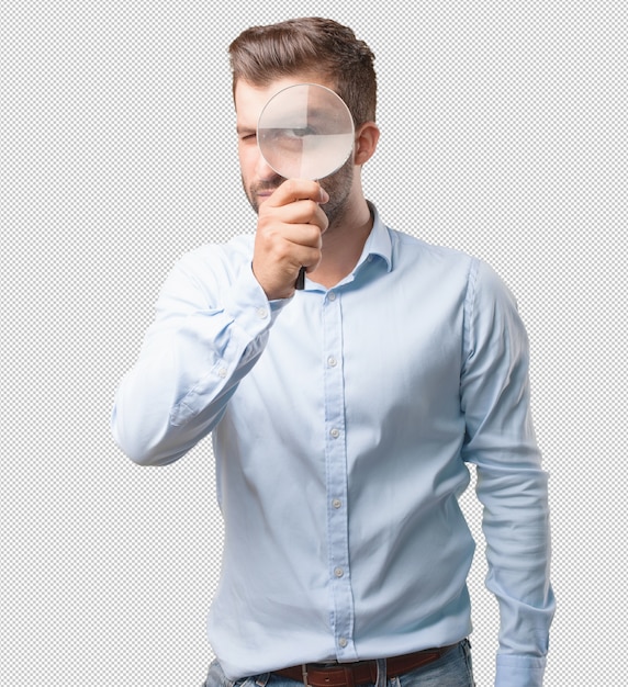 Hübscher junger mann mit lupe Premium PSD