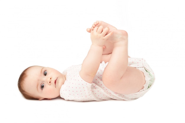 Bebe Heureux Jouant Avec Ses Pieds Isole Sur Fond Blanc Photo Premium