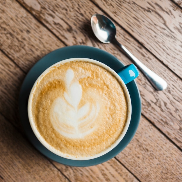 Café latte, créatif, latte, art, bois, fond texturé Photo gratuit