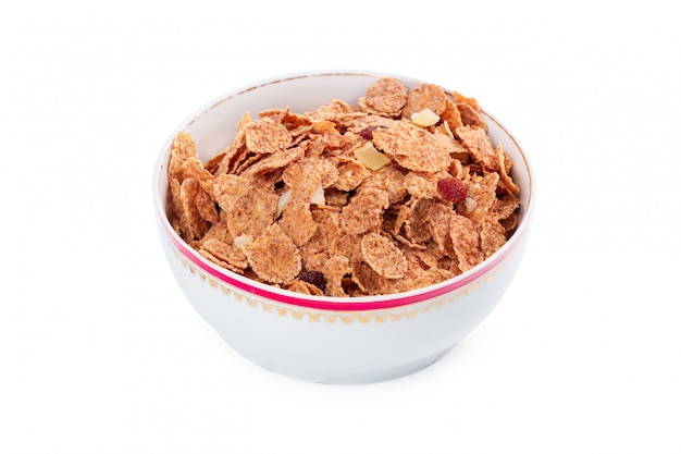 Corn flakes dans un bol isolé Photo Premium