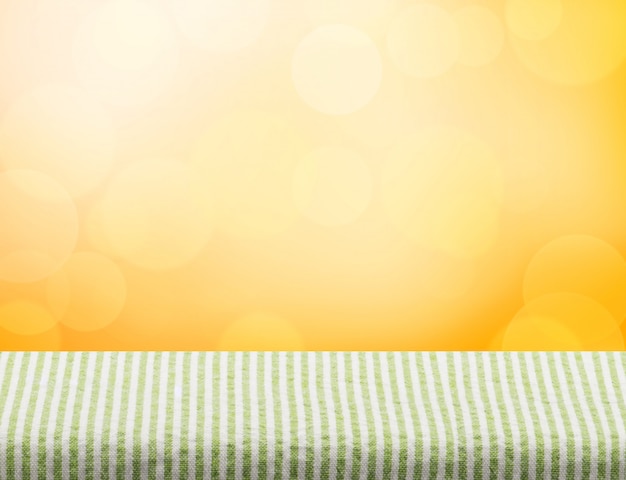 Dessus de nappe vert vide sur fond clair de bokeh orange Photo Premium