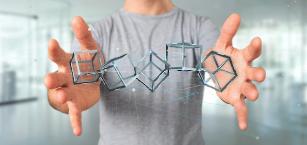 Homme tenant un cube de rendu 3d blockchain isolé sur un fond Photo Premium
