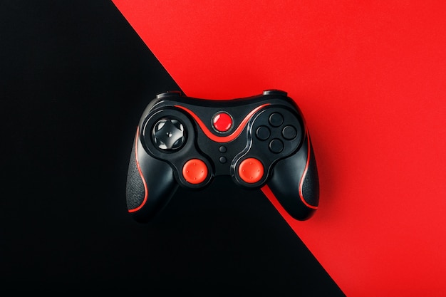  Manette  De Jeu Noire Sur Une Surface Rouge Noire Photo 