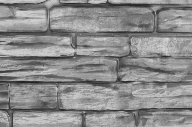 Mur de briques de fond gros plan noir et blanc. Photo Premium