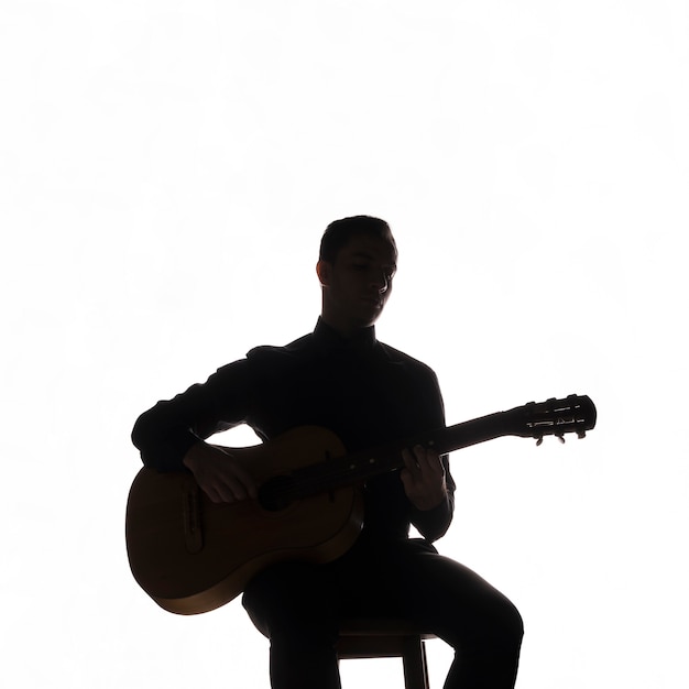  Silhouette  D un Musicien  Jouant De La Guitare Photo Gratuite