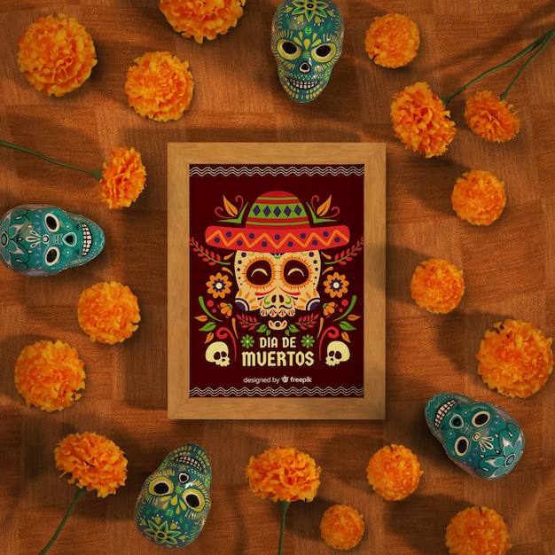 Dia de muertos mock-up omringd door schedels en bloemen Gratis Psd