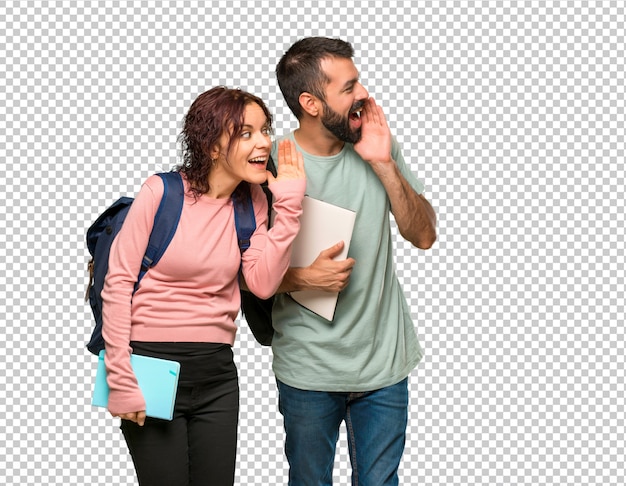 Due studenti con zaini e libri che gridano lateralmente e annunciano qualcosa Psd Premium