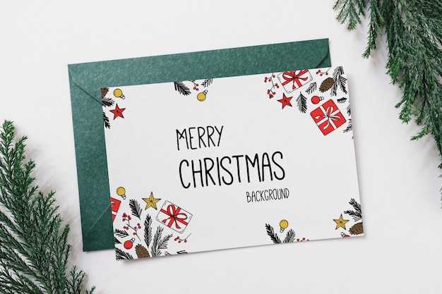 Kaart en envelopmodel met kerstmisconcept Gratis Psd
