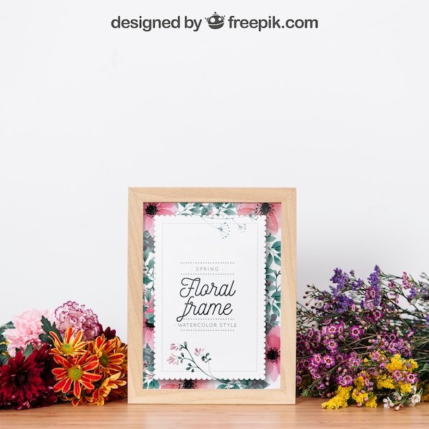 Download Mockup de marco entre hermosas flores | Archivo PSD Gratis