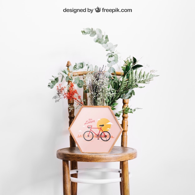 Download Mockup de marco en silla con flores | Archivo PSD Gratis