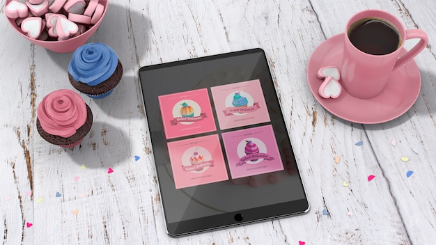 Download Mockup de tableta con cupcakes | Archivo PSD Gratis