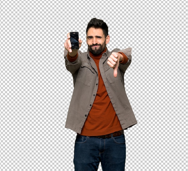 Bonito, homem, com, barba, com, perturbado, segurando, quebrada, smartphone Psd Premium