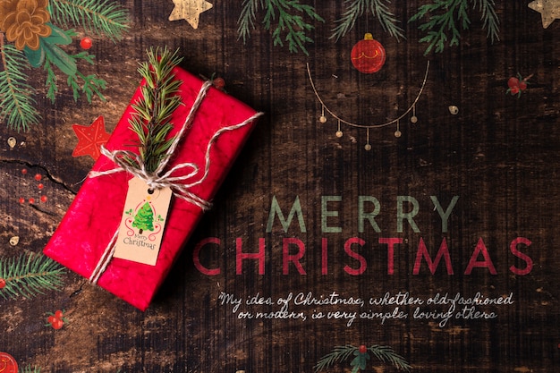 Desejo do feliz natal com presente ao lado Psd grátis