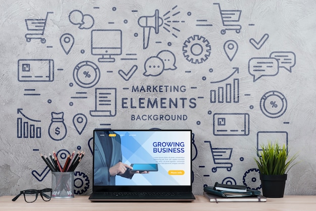 Espaço de trabalho com planta e laptop Psd grátis