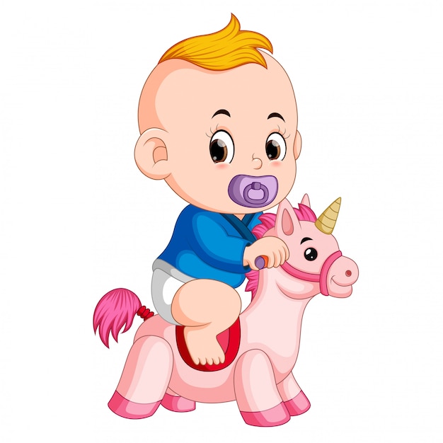 Le Bebe Joue Avec Un Jouet De Licorne Vecteur Premium