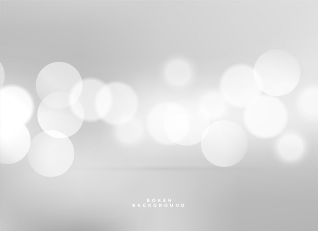 Fond de bokeh de lumières blanches élégantes Vecteur gratuit