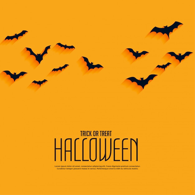 Fond d'halloween heureux jaune avec des chauves-souris volantes Vecteur gratuit