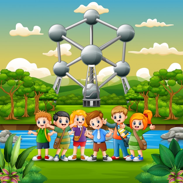 Illustration d'écoliers heureux debout devant l'atomium Vecteur Premium