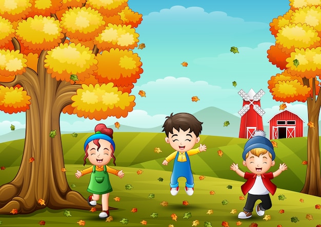 Niños felices jugando con hojas de otoño | Vector Premium