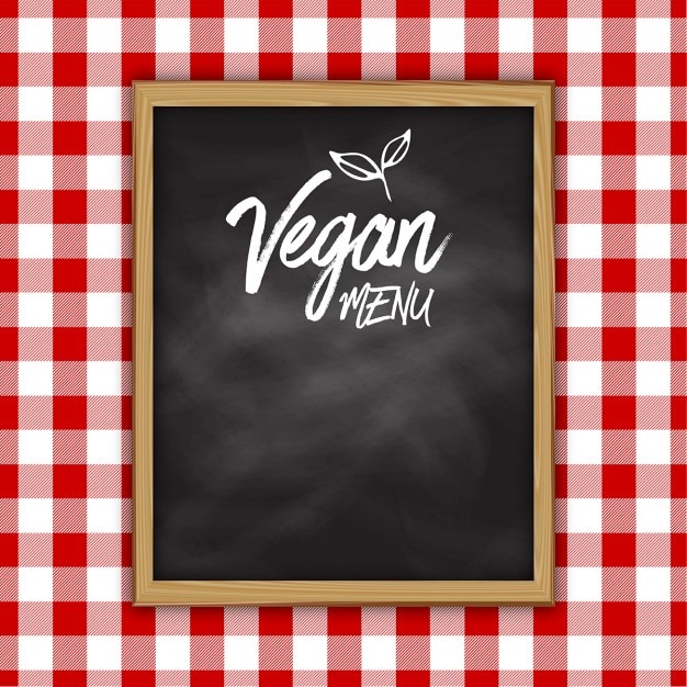 Projeto do menu do quadro-negro vegan em um fundo pano riscado Vetor grátis