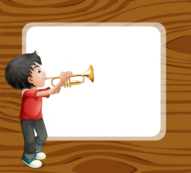 Um menino brincando com o trombone em frente a um modelo vazio Vetor grátis
