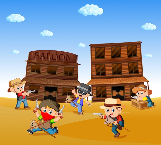 Bambini che indossano il costume da cowboy e giocano con lo sfondo della città occidentale Vettore Premium