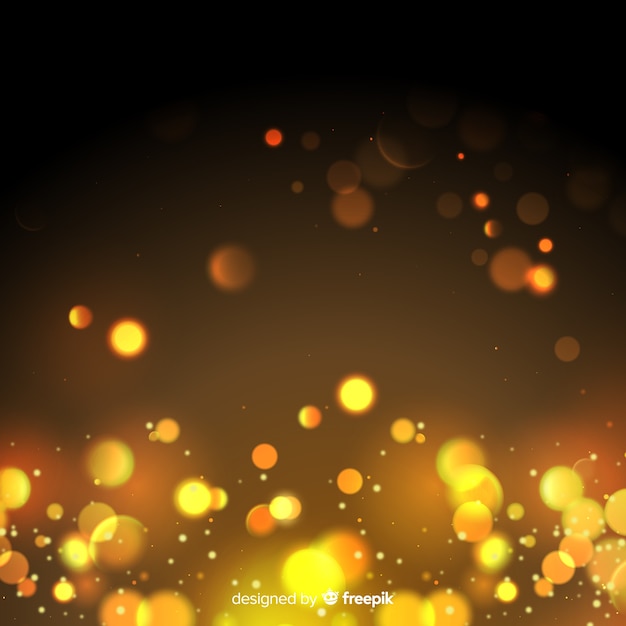 Sfondo di particelle d'oro in stile bokeh Vettore gratuito