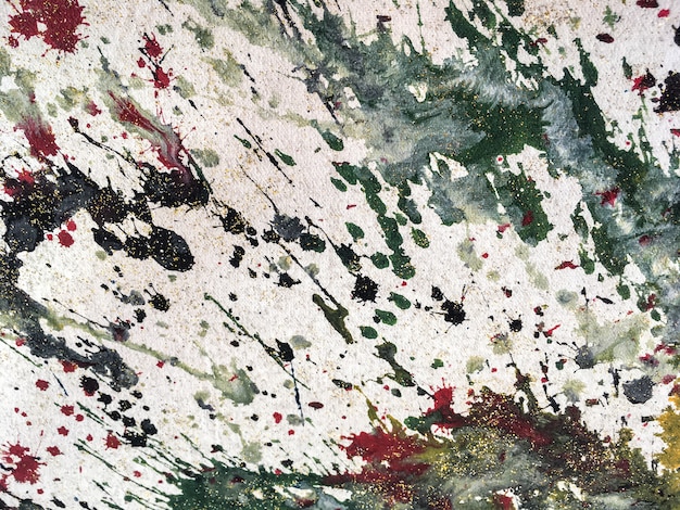 Achtergrond van kleurrijke spatten van witte en groene verf. fragment van kunstwerk Premium Foto