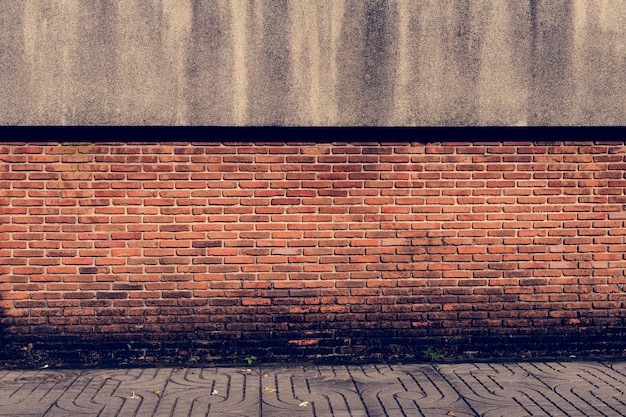 Bakstenen muur oranje achtergrond patroon Gratis Foto