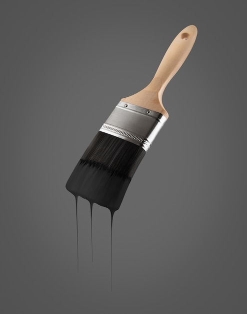 Penseel dat met zwarte kleur wordt geladen die van de varkenshaar druipt die - op zwarte achtergrond wordt geïsoleerd. Premium Foto