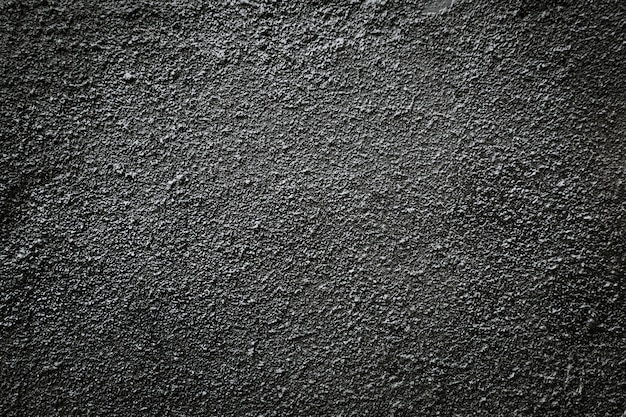 Zwarte asfalt korrelige muur. Premium Foto