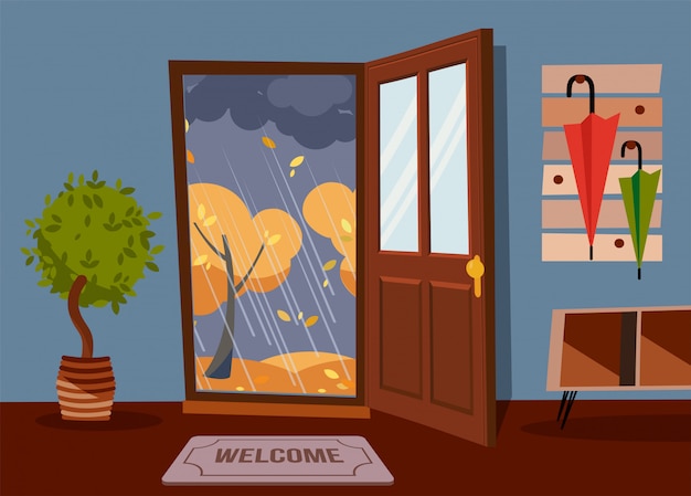 Binnenlandse gangmuur met open deur, een kapstok met paraplu's. buiten herfst regenachtige avond en gele bomen. Premium Vector