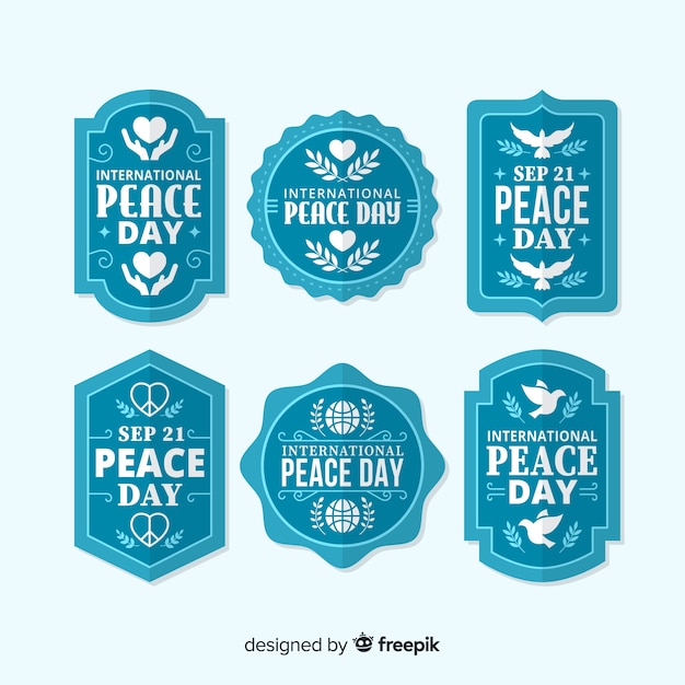 Blauwe vredesdag badge-collectie in plat ontwerp Gratis Vector