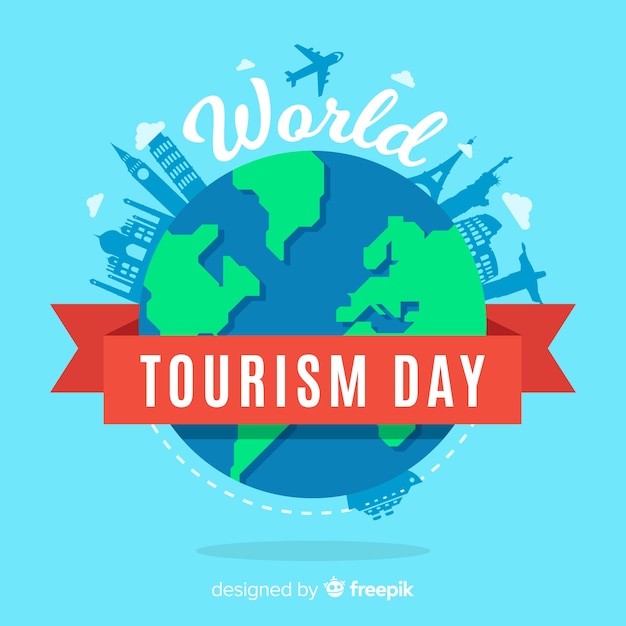De achtergrond van de toerismedag met wereld en monumenten in vlak ontwerp Gratis Vector