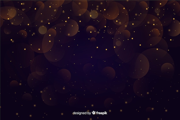 Gouden deeltjes bokeh op donkere achtergrond Gratis Vector