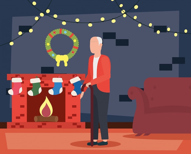 Grootvader in woonkamer met kerstmisdecoratie Gratis Vector