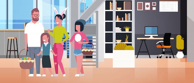 Grote familie op gelukkige pasen ouders en kinderen vieren lente vakantie slijtage bunny oren en manden houden over woonkamer interieur Premium Vector