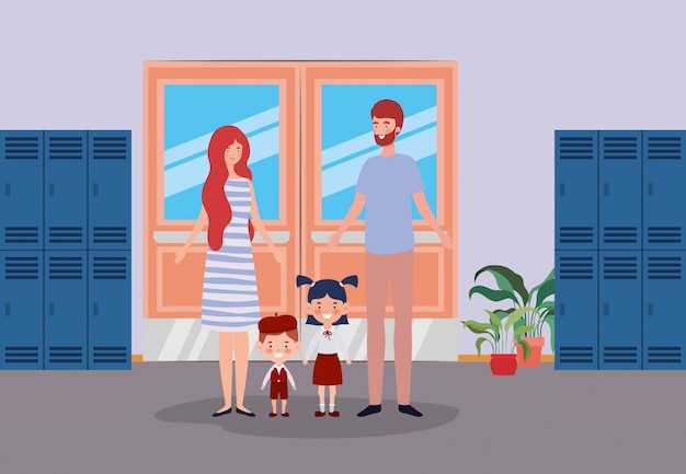 Leraarspaar met kleine studentenjonge geitjes in de schoolgang Gratis Vector