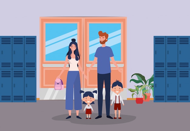 Leraarspaar met kleine studentenjonge geitjes in de schoolgang Gratis Vector
