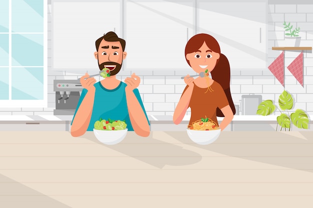 Paar dat voedsel, vegetarische, gezonde levensstijl in keuken eet Premium Vector