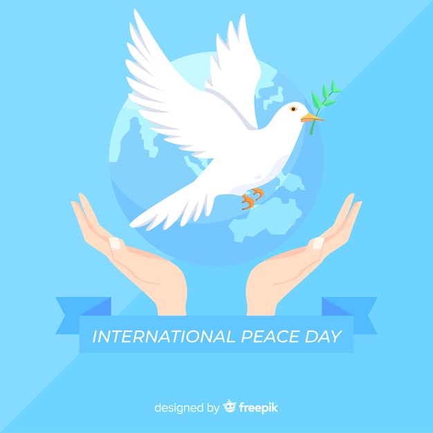 Platte vredesdag achtergrond met duif Gratis Vector