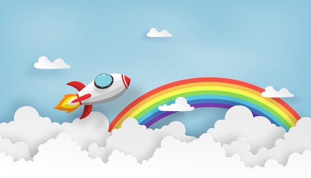 Ruimteschip of raketlancering in de hemel over de wolken en de regenboog. Premium Vector