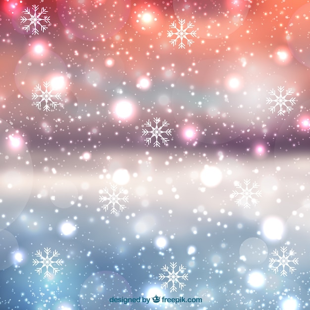 Wazige kerst achtergrond met sneeuwvlokken | Gratis Vector